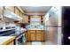 Efficient kitchen with stainless steel appliances and wood cabinetry at 4124 Five Points Rd, Indianapolis, IN 46239