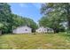 The expansive backyard features a home with a detached garage, offering ample space and privacy at 4255 N County Road 1025 E, Indianapolis, IN 46234