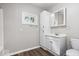 Cozy bathroom featuring a vanity, medicine cabinet, toilet and fresh neutral paint at 4255 N County Road 1025 E, Indianapolis, IN 46234