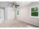 Simple bedroom with plush carpet, neutral walls, and natural light from windows at 4255 N County Road 1025 E, Indianapolis, IN 46234