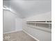 Walk-in closet featuring carpet and clothing rack and neutral paint at 4255 N County Road 1025 E, Indianapolis, IN 46234