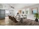 Dining room area featuring hardwood floors, neutral paint, and views of the kitchen at 4255 N County Road 1025 E, Indianapolis, IN 46234