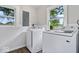 Convenient laundry room with new front-load washer and dryer and ample natural light at 4255 N County Road 1025 E, Indianapolis, IN 46234
