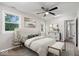 Comfortable main bedroom featuring neutral walls, carpet, artwork, and large windows for natural light at 4255 N County Road 1025 E, Indianapolis, IN 46234