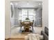 Bright dining room with a wood table, skylights, and modern decor at 4275 Springwood Trl, Indianapolis, IN 46228