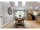Dining room with hardwood floors and lots of natural light, open to kitchen at 4275 Springwood Trl, Indianapolis, IN 46228