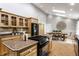 Bright kitchen offering light wood cabinets, stainless steel appliances, and an island cooktop at 4275 Springwood Trl, Indianapolis, IN 46228