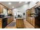 Well-lit kitchen offers plenty of cabinet space, an island cooktop, and sliding door access to another room at 4275 Springwood Trl, Indianapolis, IN 46228
