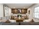 Cozy living room featuring a unique wood accent wall and stylish furnishings at 4275 Springwood Trl, Indianapolis, IN 46228