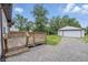 Backyard with wooden deck and detached garage at 450 N Fenton Ave, Indianapolis, IN 46219
