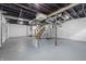 Spacious unfinished basement with exposed ceiling beams and supporting pillars at 450 N Fenton Ave, Indianapolis, IN 46219