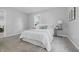 Bright bedroom featuring plush carpet, large windows for ample natural light and neutral decor at 450 N Fenton Ave, Indianapolis, IN 46219