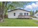 Charming home featuring a cozy front porch, well-maintained lawn, and welcoming curb appeal at 450 N Fenton Ave, Indianapolis, IN 46219