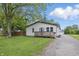 Inviting home with a front porch, driveway, and lovely landscaping enhancing its overall appeal at 450 N Fenton Ave, Indianapolis, IN 46219