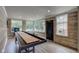 Basement featuring hardwood floors, recessed lights, and a shuffleboard table at 4853 E 65Th St, Indianapolis, IN 46220