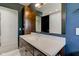 Bathroom featuring a white countertop, stylish cabinetry, and modern lighting at 4853 E 65Th St, Indianapolis, IN 46220