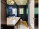 Bathroom featuring a stylish sink, mirror, and lighting fixtures at 4853 E 65Th St, Indianapolis, IN 46220