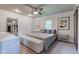 Bright bedroom features a ceiling fan, accent furniture, and decor at 4853 E 65Th St, Indianapolis, IN 46220