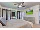 Bedroom features a ceiling fan, television, and en-suite bathroom at 4853 E 65Th St, Indianapolis, IN 46220