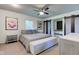 Bright bedroom features a ceiling fan, accent furniture, and decor at 4853 E 65Th St, Indianapolis, IN 46220