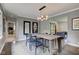 Dining room with modern lighting and an oversized table at 4853 E 65Th St, Indianapolis, IN 46220