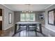Dining room features a modern chandelier and large picture window at 4853 E 65Th St, Indianapolis, IN 46220