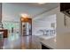 Spacious kitchen with stainless steel refrigerator, dark wood cabinets, and an open layout into other rooms at 4853 E 65Th St, Indianapolis, IN 46220