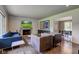 Spacious living room with stylish decor, fireplace, and dining area view at 4853 E 65Th St, Indianapolis, IN 46220