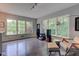 Bright living room with large windows, hardwood floors, stylish furniture, and plenty of natural light at 4853 E 65Th St, Indianapolis, IN 46220