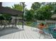 Spacious backyard deck with comfortable seating, ideal for entertaining and enjoying serene outdoor living at 5133 E Michigan St, Indianapolis, IN 46219