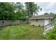 Lush backyard featuring a well-maintained lawn and garden, offering a tranquil and private outdoor space at 5133 E Michigan St, Indianapolis, IN 46219
