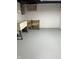 Unfinished basement with laundry sink and painted cinder block wall at 5133 E Michigan St, Indianapolis, IN 46219