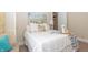 Cozy bedroom featuring a large bed, soft lighting, and inviting decor, creating a serene atmosphere at 5133 E Michigan St, Indianapolis, IN 46219