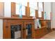 Charming built-in cabinet with leaded glass doors and a window seat in a well-lit dining area at 5133 E Michigan St, Indianapolis, IN 46219