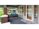Inviting front porch with a swing, stylish rug, and a charming entrance door at 5133 E Michigan St, Indianapolis, IN 46219