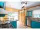 Bright kitchen with modern appliances, colorful cabinets, and a functional island with seating at 5133 E Michigan St, Indianapolis, IN 46219