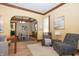 A spacious living room seamlessly connects to the dining area, creating an open and inviting atmosphere at 5133 E Michigan St, Indianapolis, IN 46219