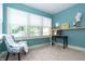 Bright office with natural light, featuring a functional desk, stylish decor, and a tranquil workspace atmosphere at 5133 E Michigan St, Indianapolis, IN 46219