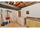 Unfinished basement with exposed ceiling, utility sink, and room for storage and customization at 5153 Brendonshire Ct, Indianapolis, IN 46226