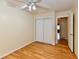 Well-lit bedroom boasts hardwood floors, ample closet space, and serene atmosphere at 5153 Brendonshire Ct, Indianapolis, IN 46226