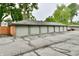 A row of garages offer convenient parking for residents with a cracked parking lot at 5153 Brendonshire Ct, Indianapolis, IN 46226