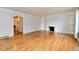 Spacious living room with hardwood floors, natural light, and a cozy fireplace at 5153 Brendonshire Ct, Indianapolis, IN 46226