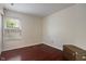 Bedroom with wood floors, natural light, and a neutral color palette at 5216 Lakeside Manor Blvd, Indianapolis, IN 46254