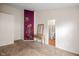 Bright bedroom with a decorative wall feature and access to an ensuite bathroom at 5216 Lakeside Manor Blvd, Indianapolis, IN 46254