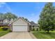 Attractive single-Gathering house with a well-manicured lawn and a cozy front porch at 5216 Lakeside Manor Blvd, Indianapolis, IN 46254