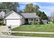 Charming single-story home featuring a well-maintained lawn and attached two-car garage at 5216 Lakeside Manor Blvd, Indianapolis, IN 46254