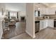 Modern kitchen with stainless steel appliances and hardwood floors, flowing into the living room at 5216 Lakeside Manor Blvd, Indianapolis, IN 46254