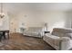 Spacious living room with hardwood floors, high ceilings, and comfortable seating at 5216 Lakeside Manor Blvd, Indianapolis, IN 46254