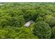 Secluded home nestled within a dense forest, offering privacy and natural beauty at 5975 S 800 E, Zionsville, IN 46077