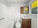 Clean bathroom featuring a shower-tub, toilet and vanity with medicine cabinet at 621 N Livingston Ave, Indianapolis, IN 46222